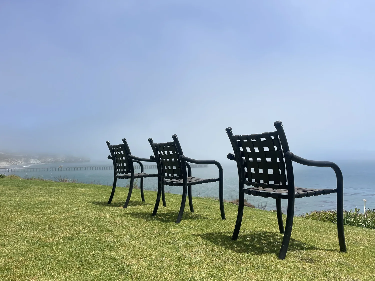 Two chairs looking out over the Central Coast coastline